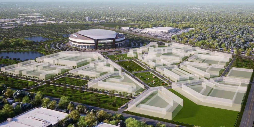 Interior of a theater with gold walls and red velvet chairs