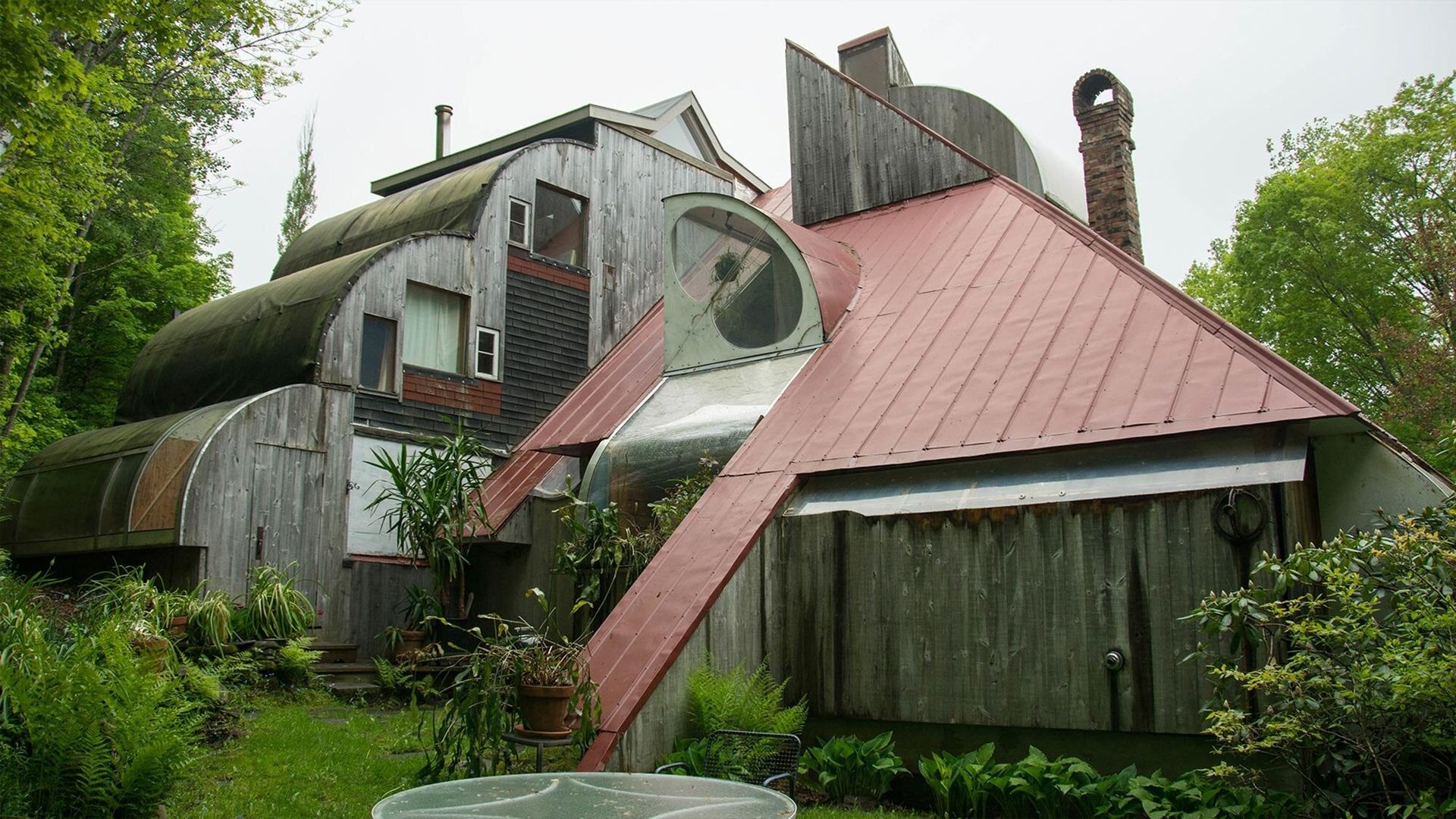 Unusual building structures with green surrounding