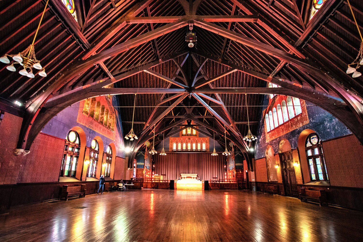 Interior of an event space with beautiful arched ceilings and mood lighting.