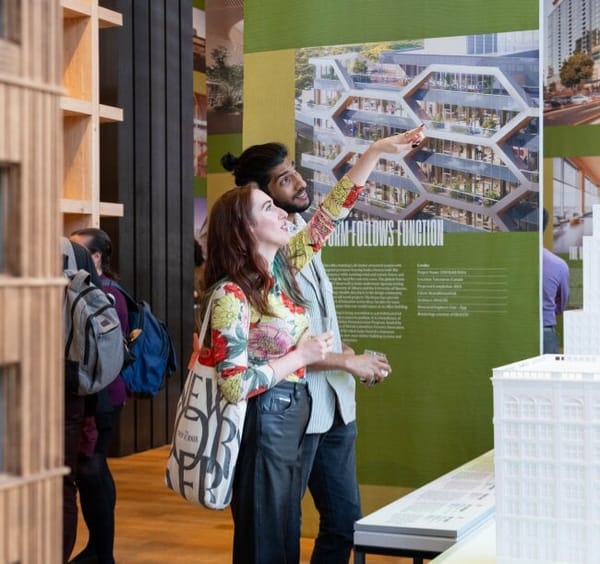 two people looking an exhibit