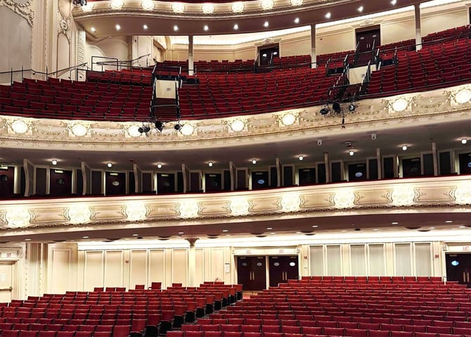 Interior of the CSO hall, red velvet theater seating with gold balconies