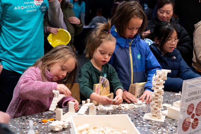 A few pre-teen girls building different projects