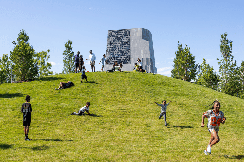 Green lawn with people on it. 