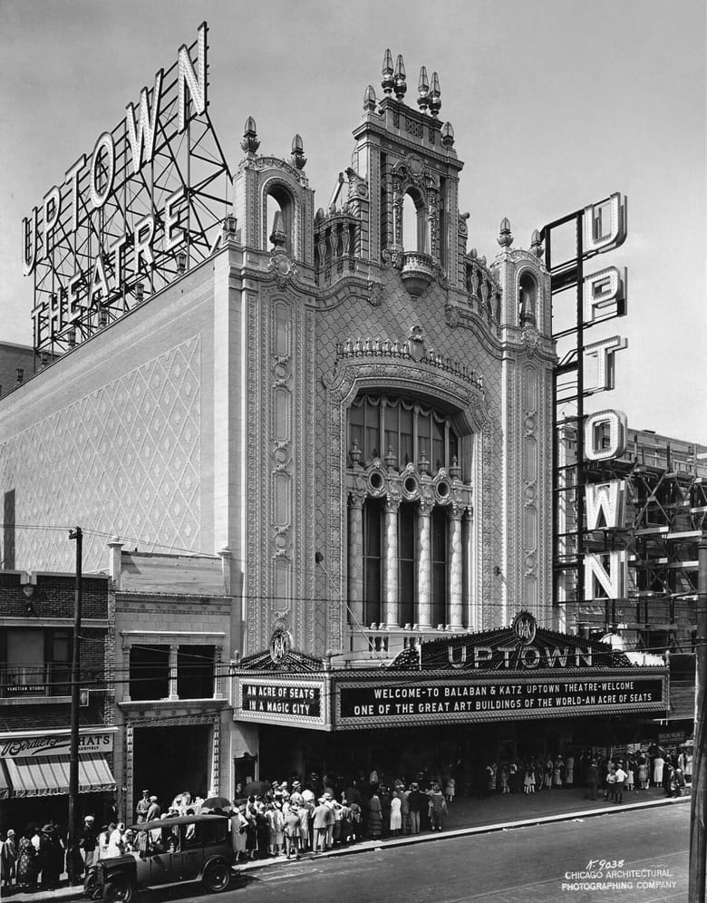 Black and white exterior image of an old theater.