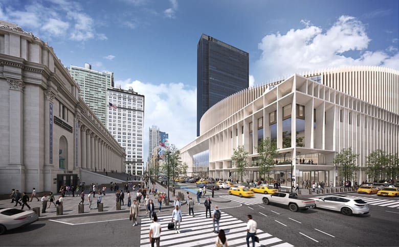 Image of a bust street on a nice day with a classic building on the left and a modern building on the right.