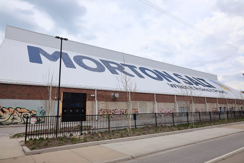 Image of a white building with a roof that says "morton"