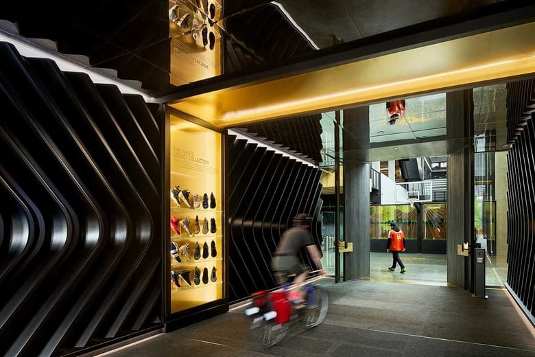 Interior corridor of the LeBron James Innovation Center with sculptural black wall panels.