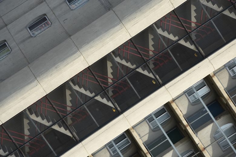 A diagonal view of a building’s staircases. 
