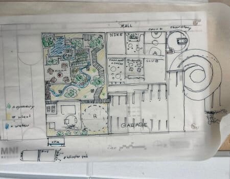 Image of drafting paper with a sketch of an architectural design on it. 