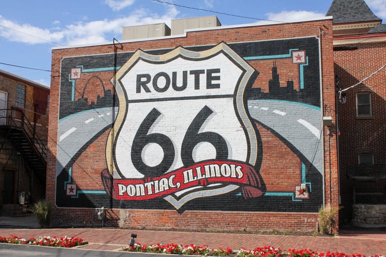 Route 66 mural on side of a brick building