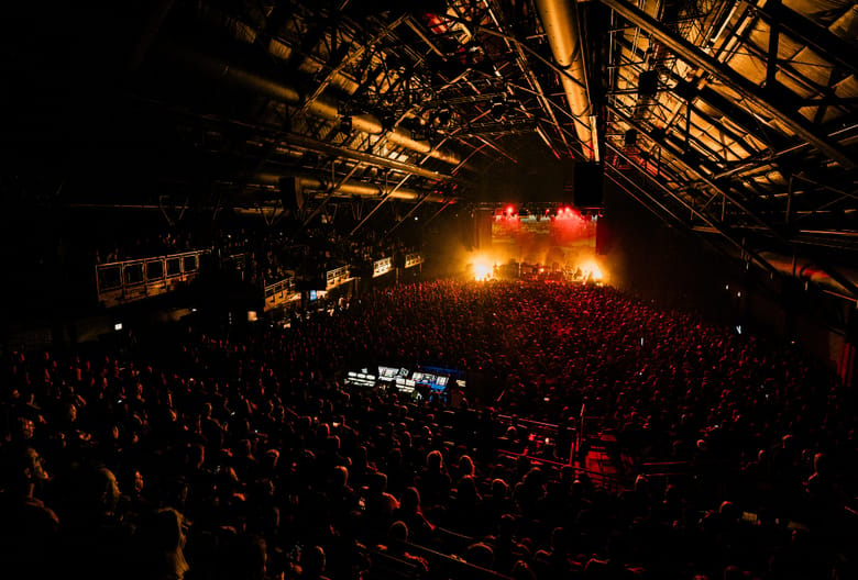 interior picture of a concert hall with crowded people.