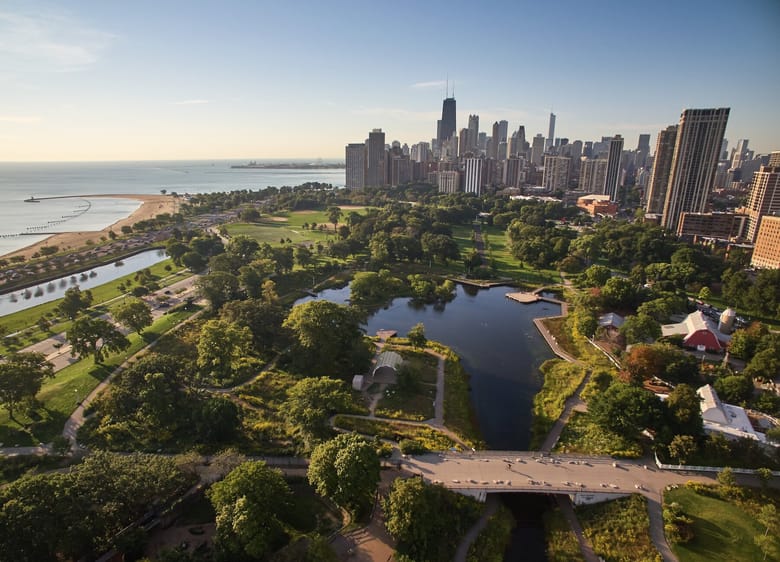 Zoomed out view of Chicago with a pond and lake.