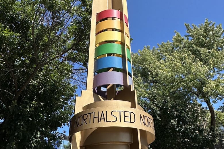 A tower with red, orange, yellow, green, blue and purple rings.