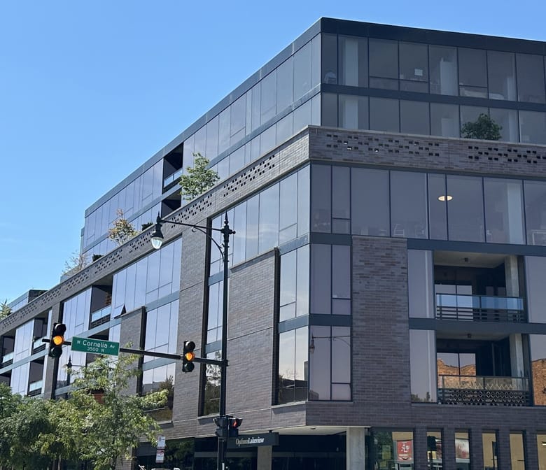 A grey brick and glass building.