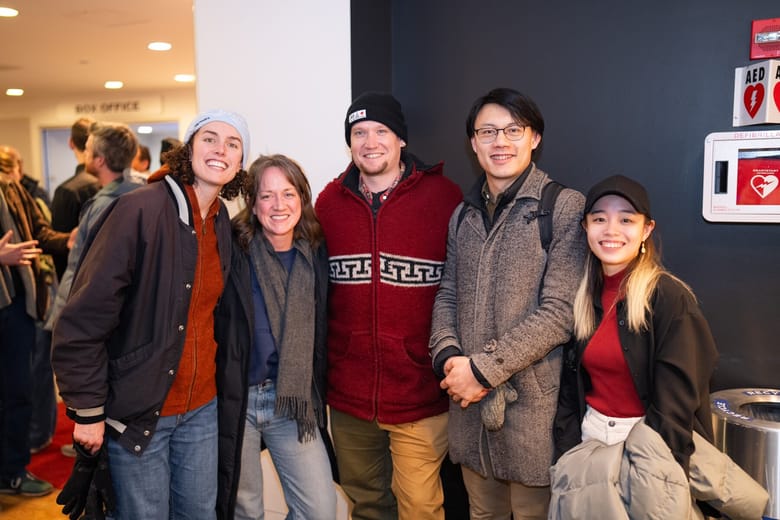 Group of people smiling.