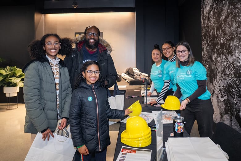Families and volunteers at an event.