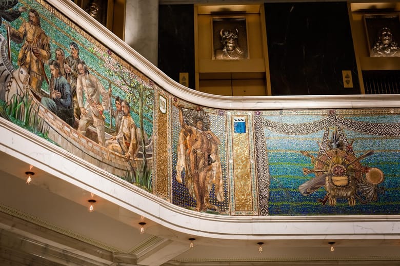 Close up shot of a colorful mosaic that illustrates people in a boat