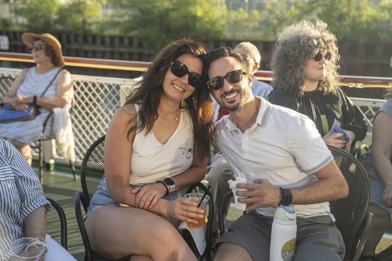 cac members sitting on a boat. 