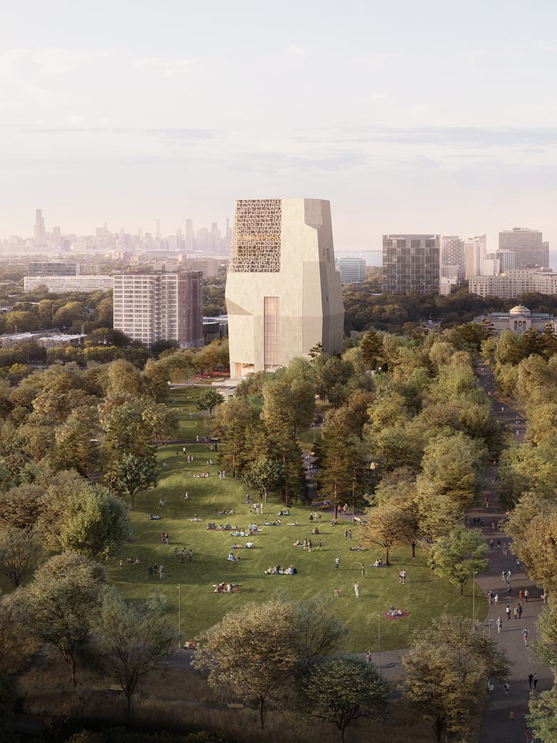 Aerial architectural rendering of the Obama Presidential Center in Chicago’s Jackson Park, featuring a tall, stone‑clad museum tower rising above a tree‑lined lawn where people are gathered and walking along paths. Surrounding the park are mid‑rise buildings, with the Chicago skyline visible in the distance under a light, hazy sky.