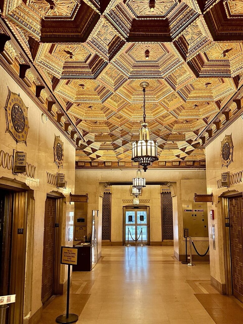 Grand interior of a hotel with elevators.