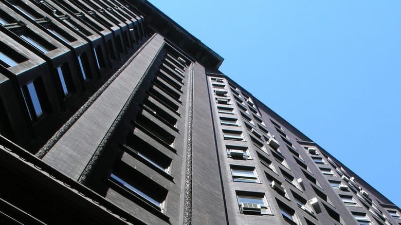 Looking up at building with blue sky