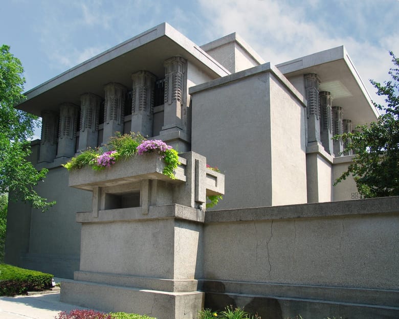 Unity Temple by Frank Lloyd Wright, showcasing modernist architecture with geometric patterns, concrete columns, and natural lighting.