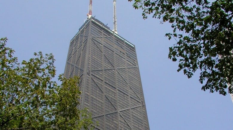 the top of a tall black skyscraper