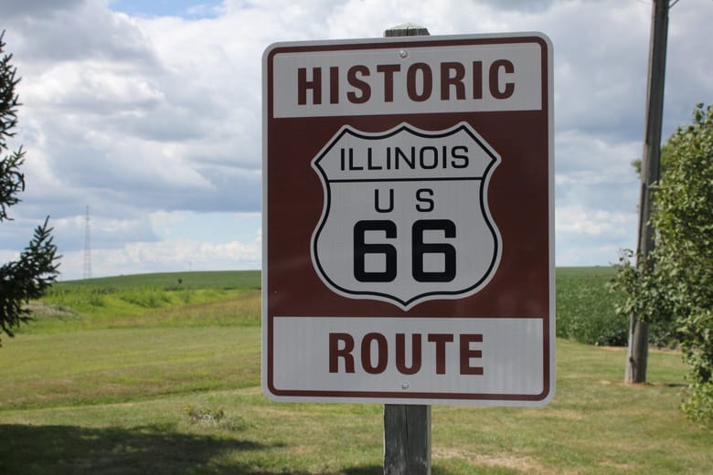 Red and white route 66 sign.