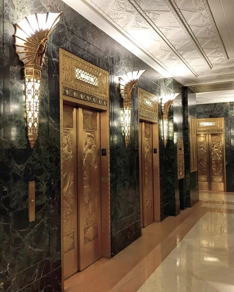 interior shot of golden elevators.