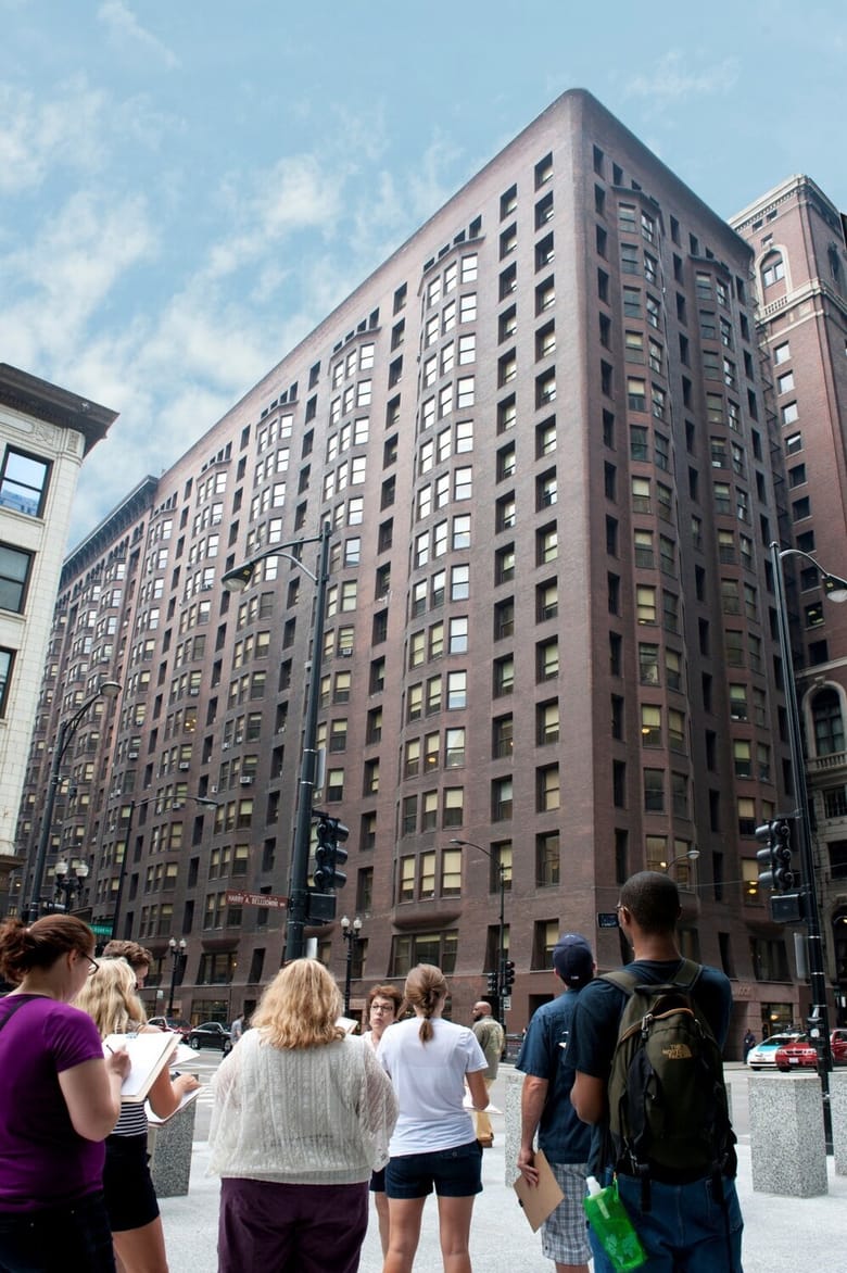 Group of tourists looking at a building