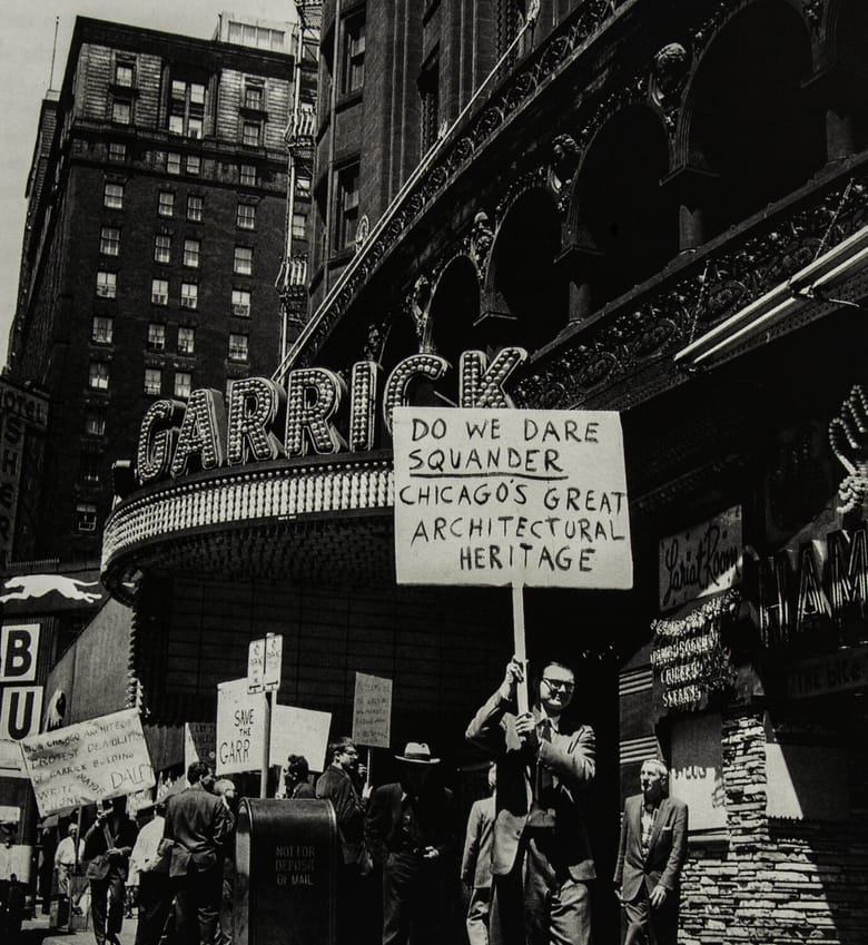 Black and white photo of people protesting.