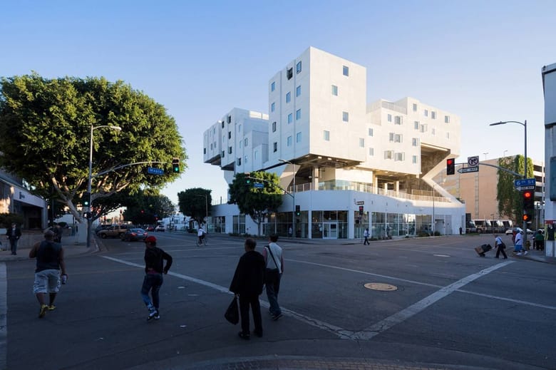 White building with several blocks jutting out at different angles.